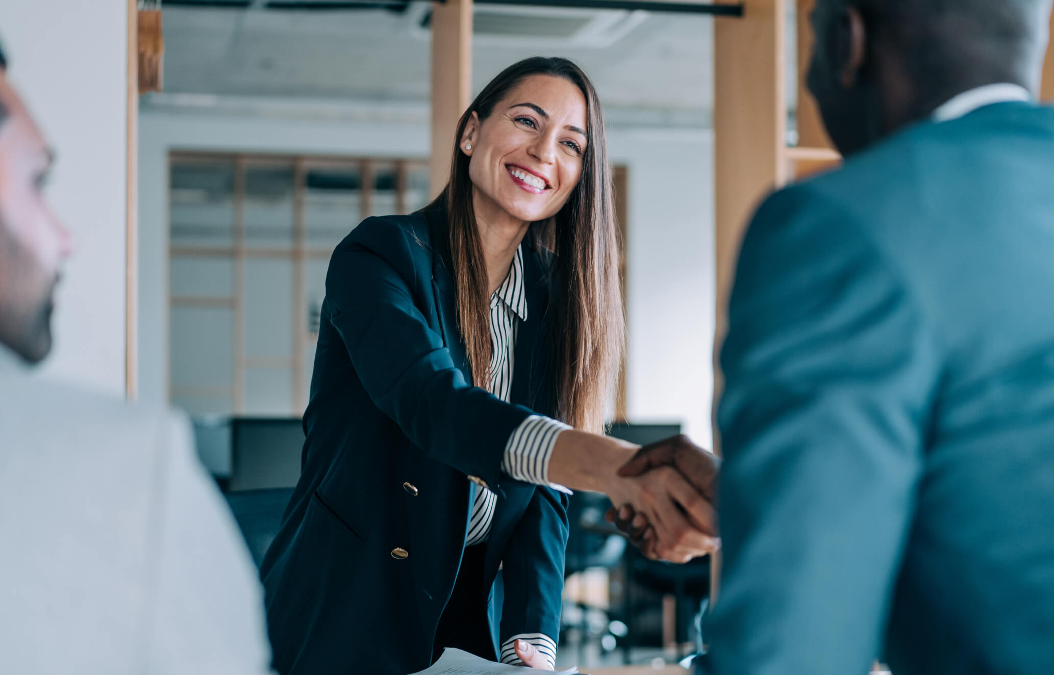Woman shaking hands with man
